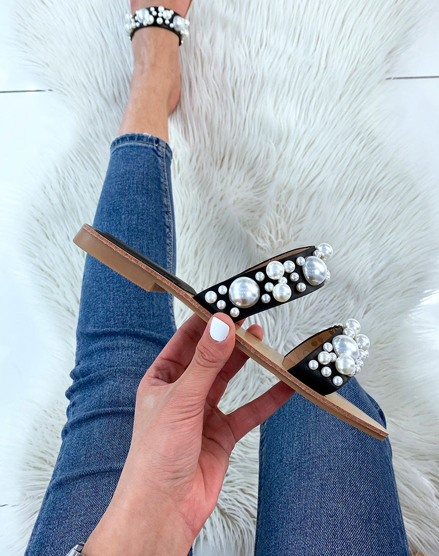 Mules plates noires à double brides