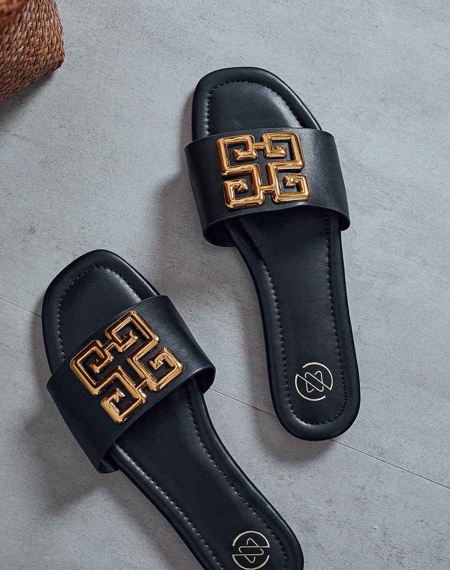 Mules plates noires à motif doré