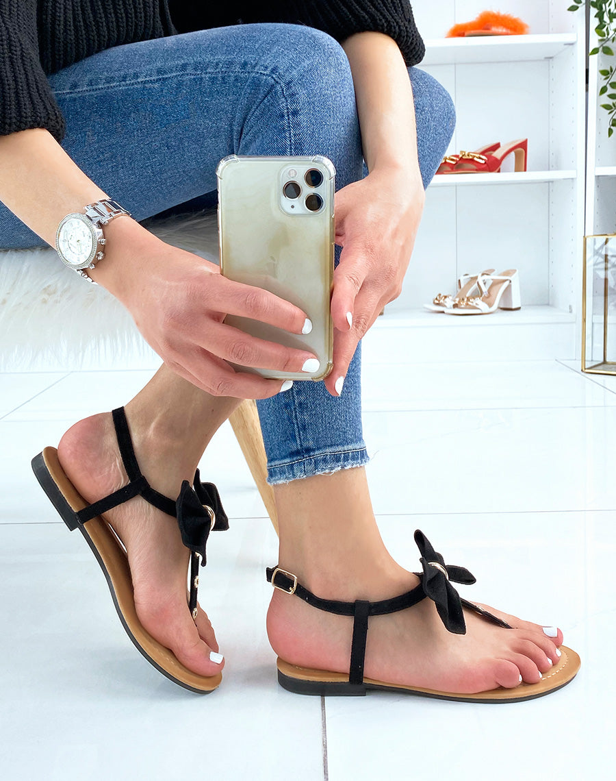 Nu-pieds noirs à nœud et détails dorés