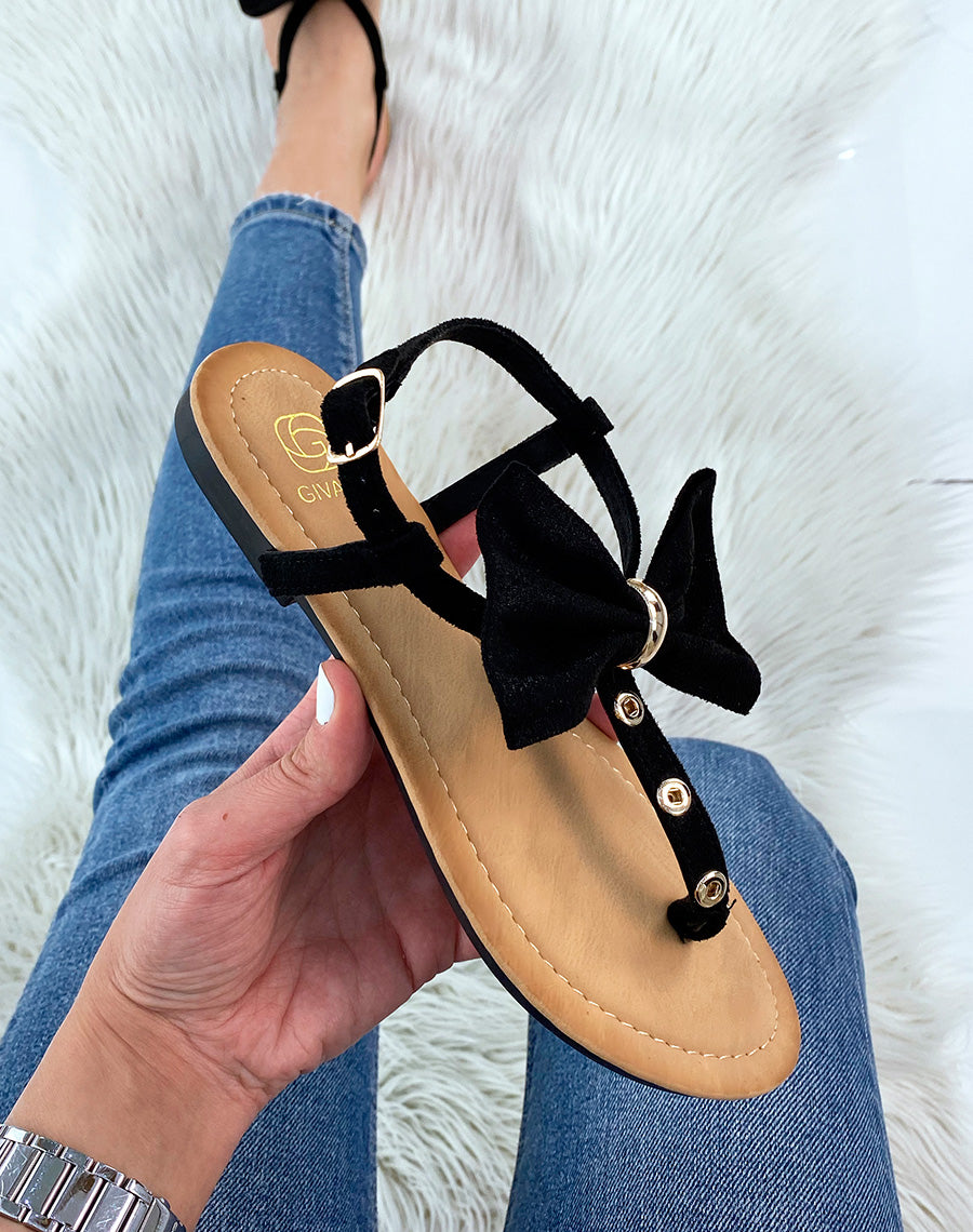 Nu-pieds noirs à nœud et détails dorés