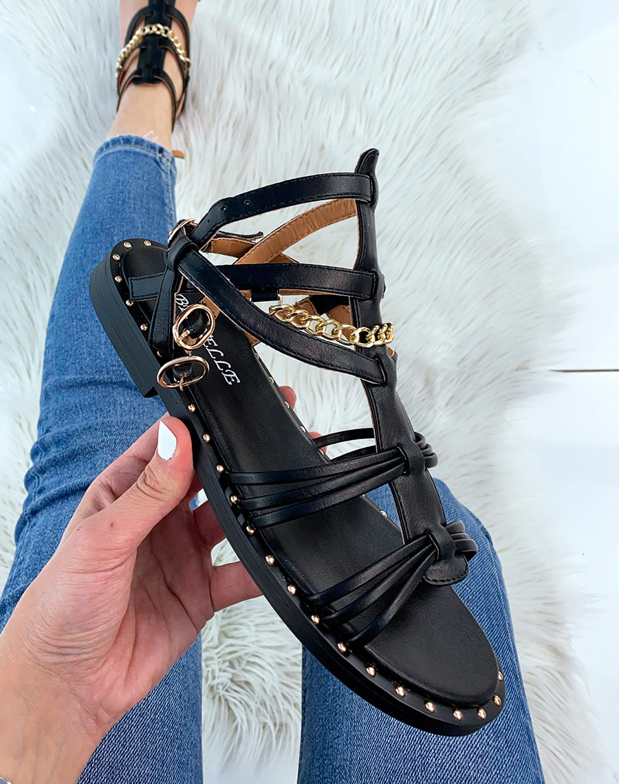 Nu-pieds noirs style spartiate avec chaîne dorée