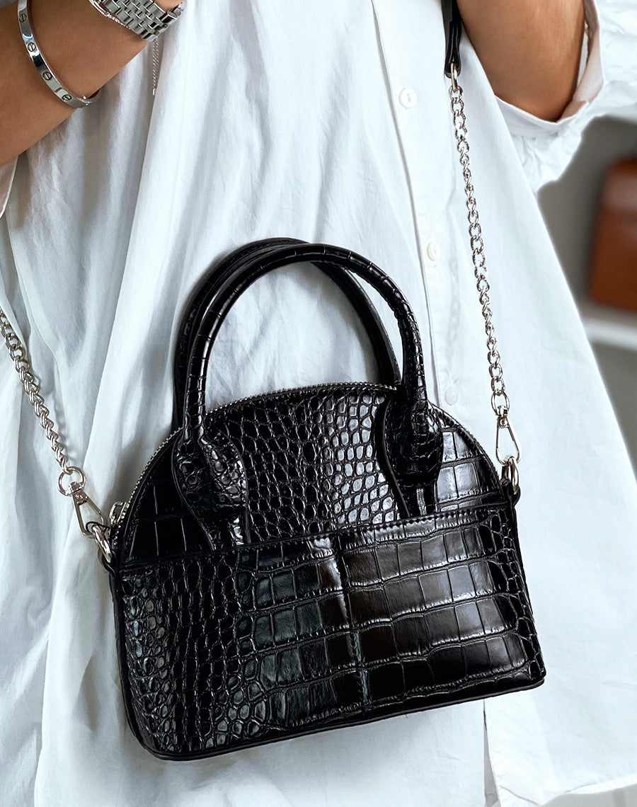 Sac en bandoulière noir arrondi effet croco