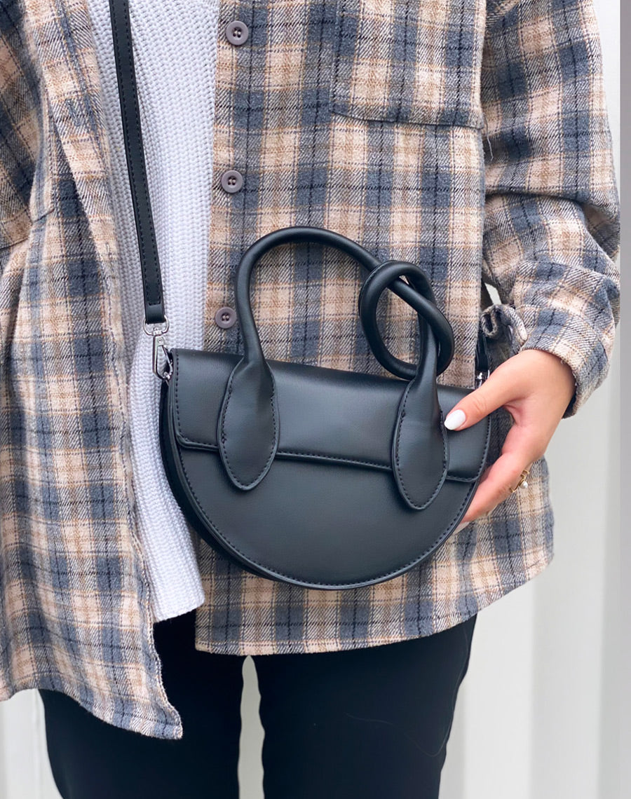 Sac à main arrondie noir à anse à nœud