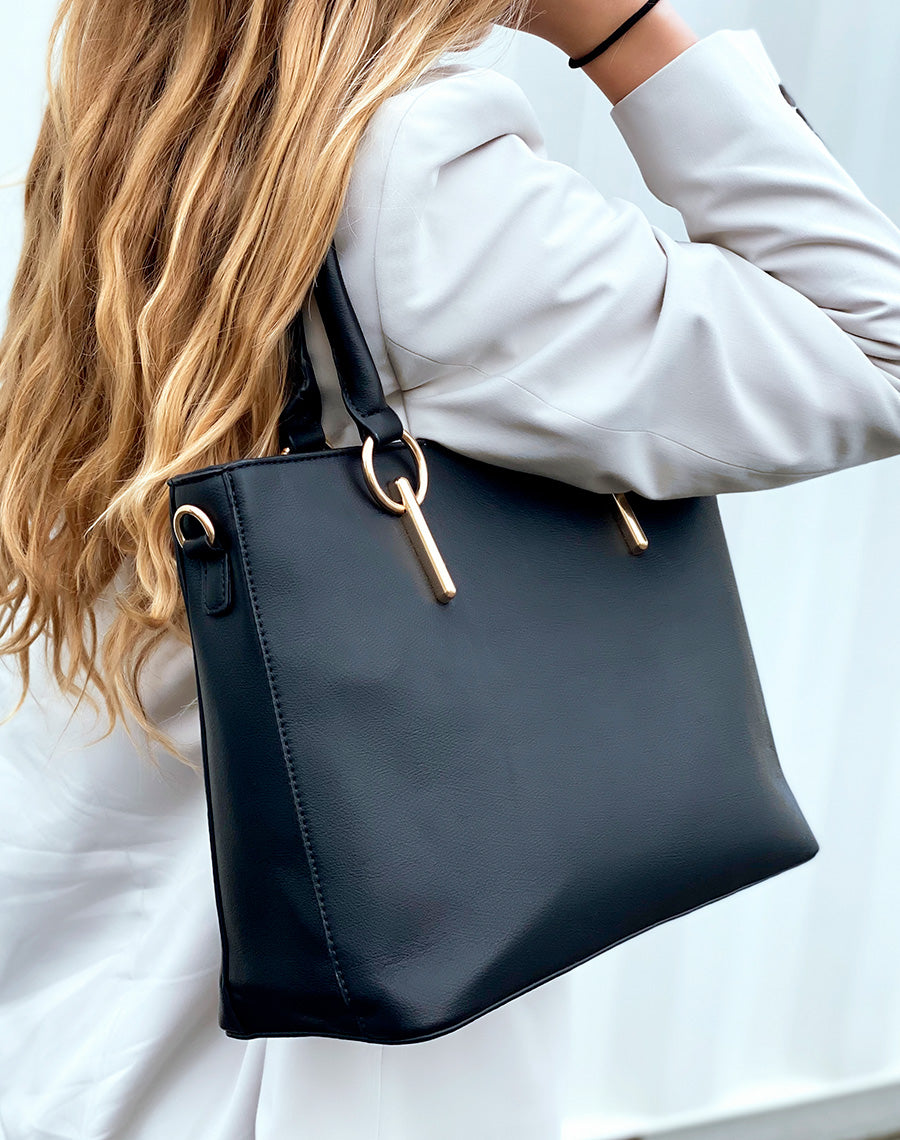 Sac à main noir à bijoux ronds dorés