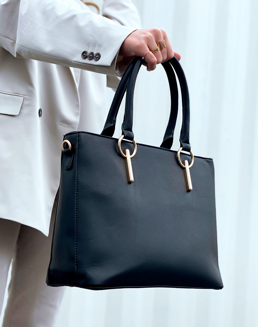 Sac à main noir à bijoux ronds dorés