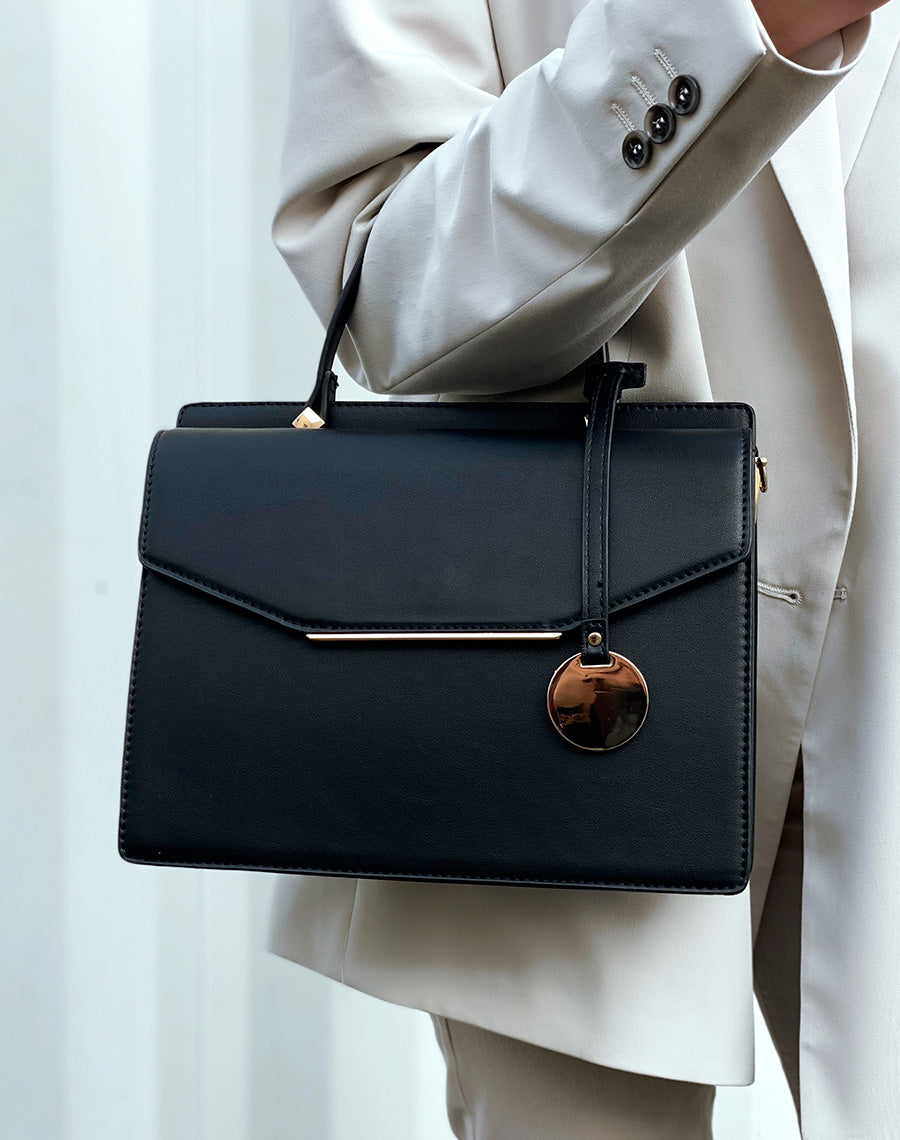 Sac à main noir à double ouverture et détails dorés