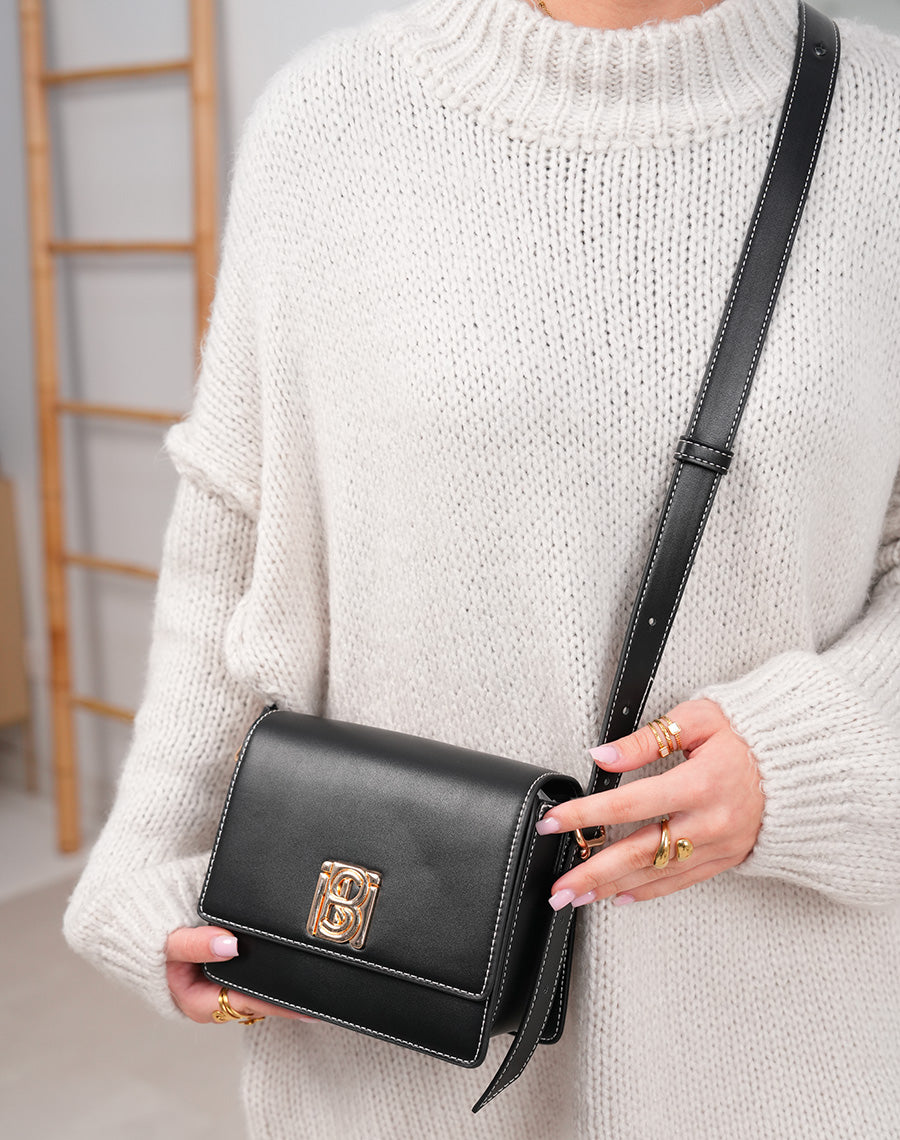 Sac noir à lanière ajustable