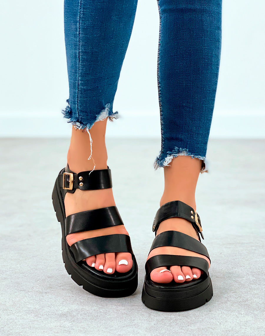 Sandales noires à plateforme crantée et lanières à détail dorée