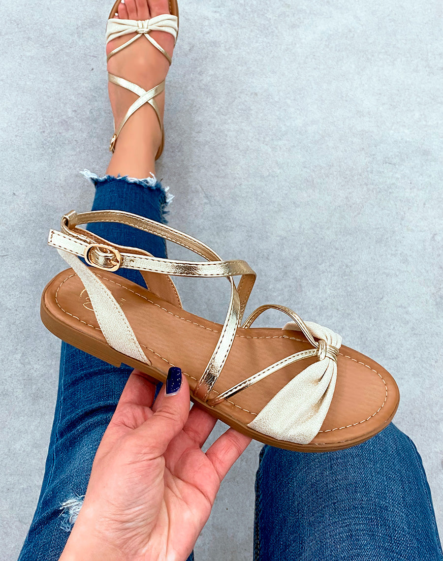 Sandales plates beige pailletée à noeud et lanières dorées
