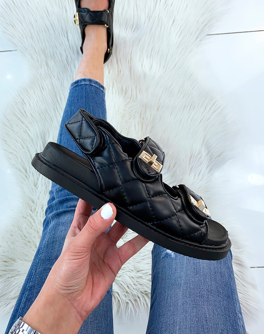 Sandales plates noires à effet matelassé