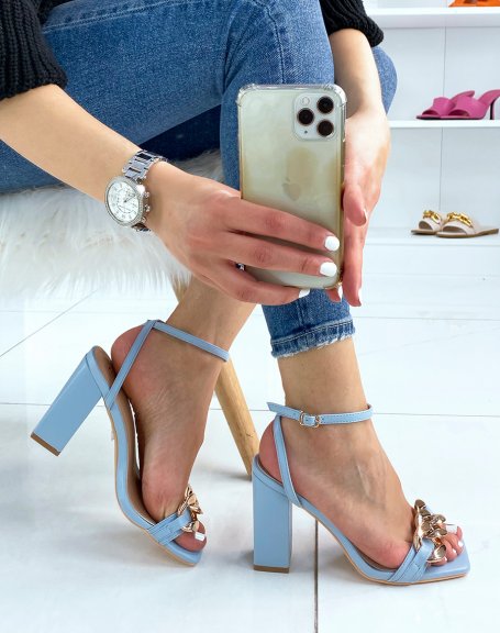 Baby blue heeled sandals with thin straps and gold chain