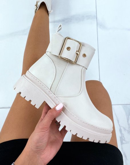 Beige ankle boots with thick and golden strap