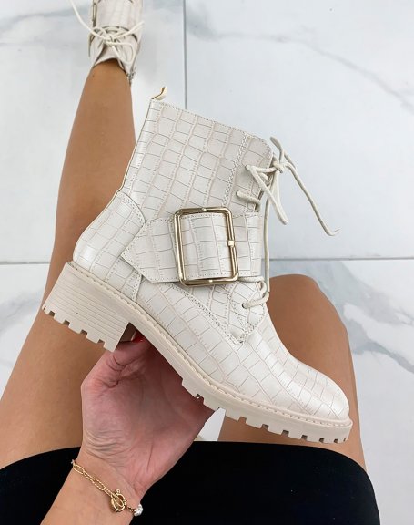 Beige croc-effect ankle boots adorned with a large golden buckle