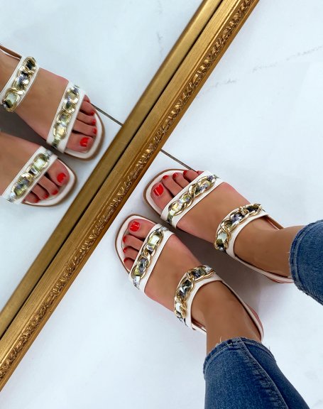 Beige flat sandals with golden and floral details