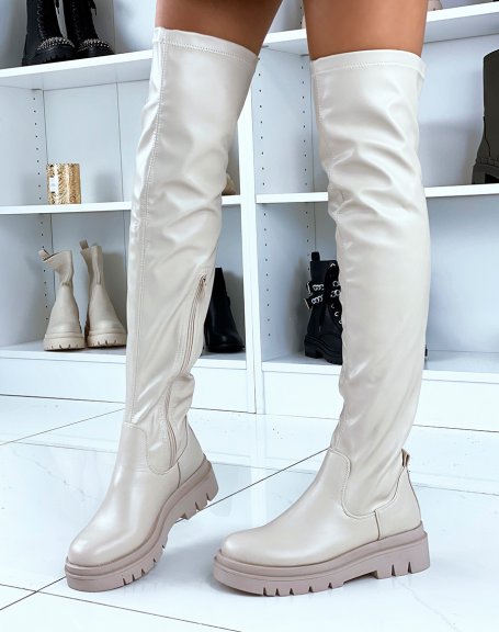 Beige flat thigh-high boots with notched platform