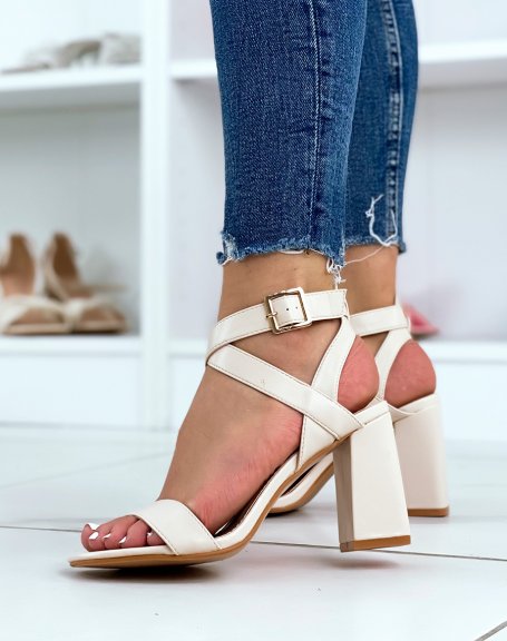 Beige heeled sandals with criss-cross straps