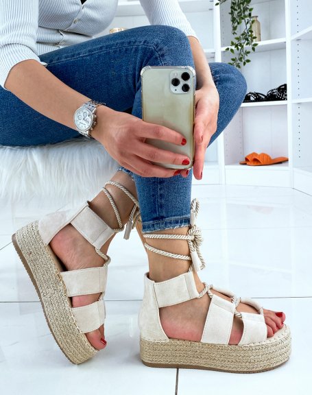 Beige lace-up wedges and hessian sole