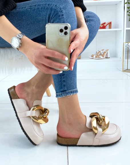 Beige moccasin-style mules with big gold chain
