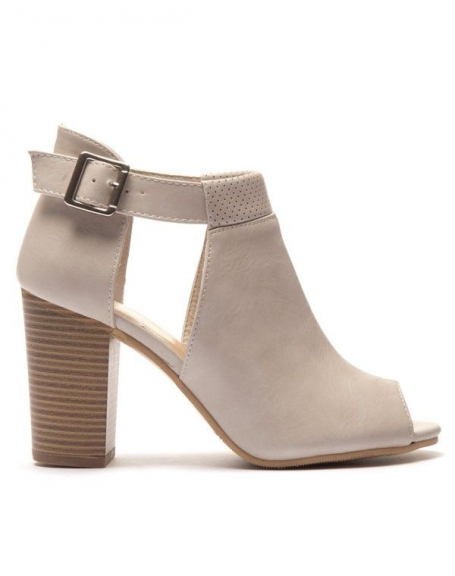 Beige open toe ankle boot with cutout and perforations