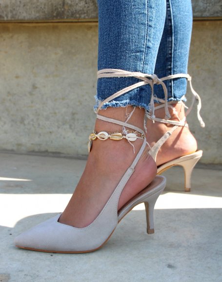 Beige pumps open at the back with long straps