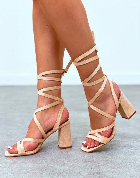 Beige sandals with narrow straps crossed with lace and heel