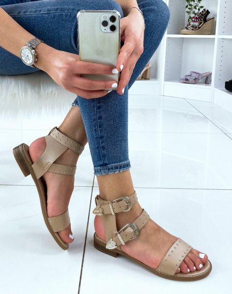 Beige sandals with studded details