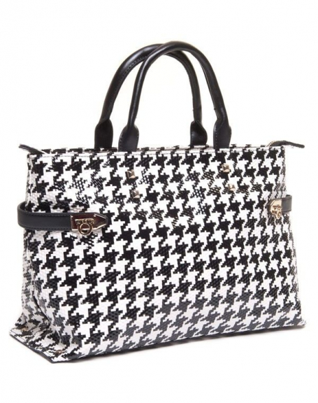 Black and white houndstooth tote bag with studs and straps