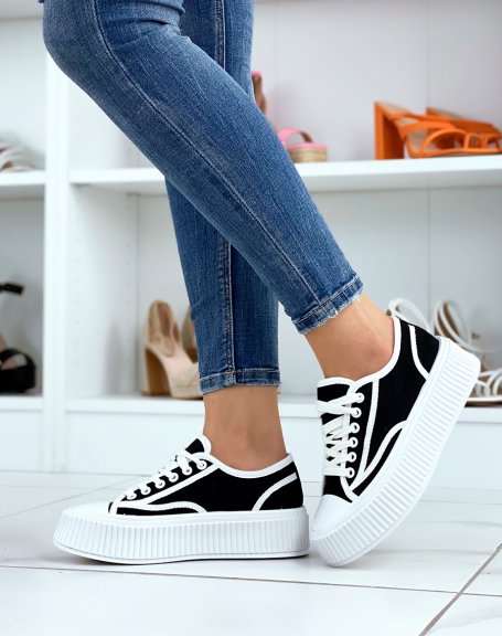 Black and white low-top sneakers with thick sole