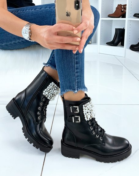 Black ankle boots adorned with multiple pearls