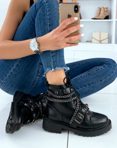 Black ankle boots adorned with multiple straps