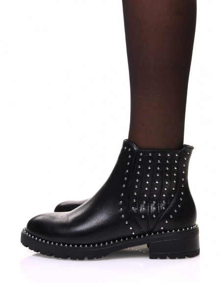 Black ankle boots adorned with small studs on the sides