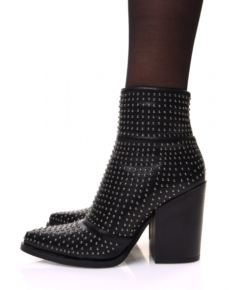 Black ankle boots with heel and pointed toe, adorned with small studs