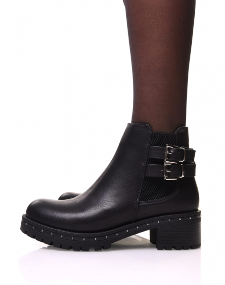 Black ankle boots with lugged and studded sole
