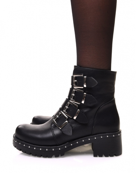 Black ankle boots with multiple straps and studded sole
