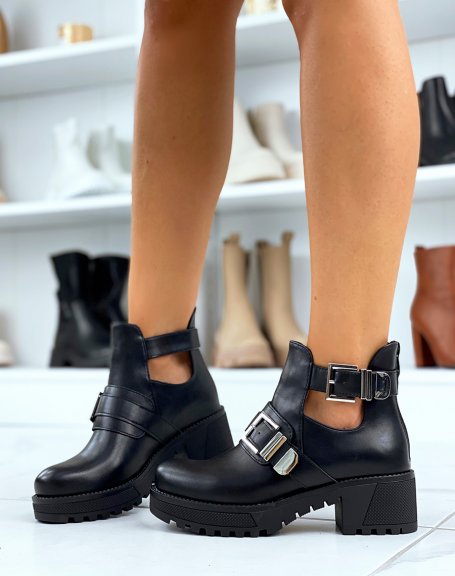 Black ankle boots with notched soles and double straps