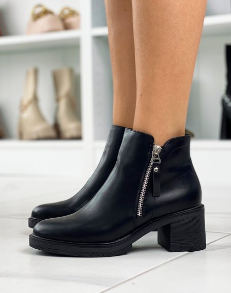Black ankle boots with small heel and silver zip