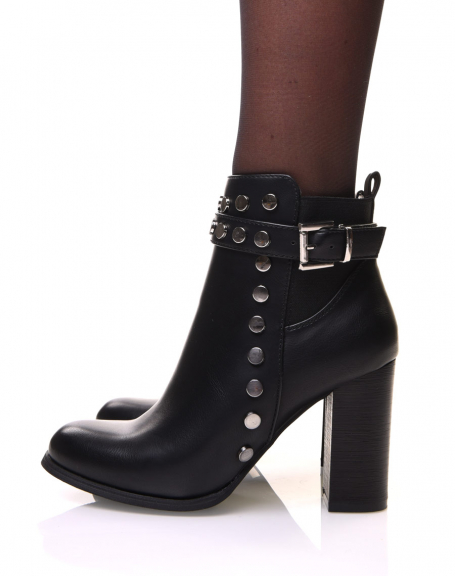 Black ankle boots with strap, studded details and heels
