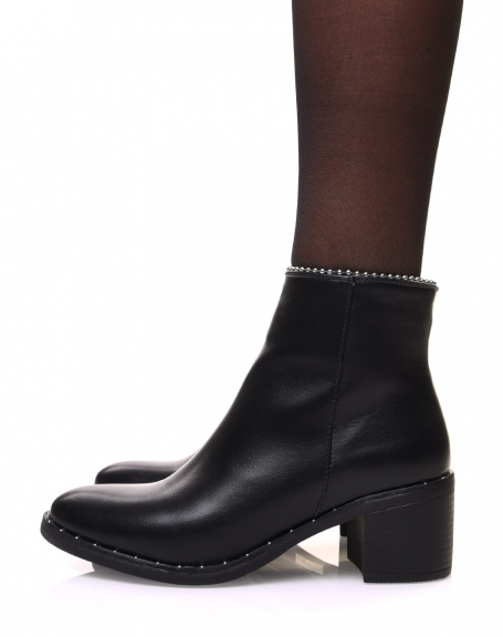 Black ankle boots with studded sole and beaded top