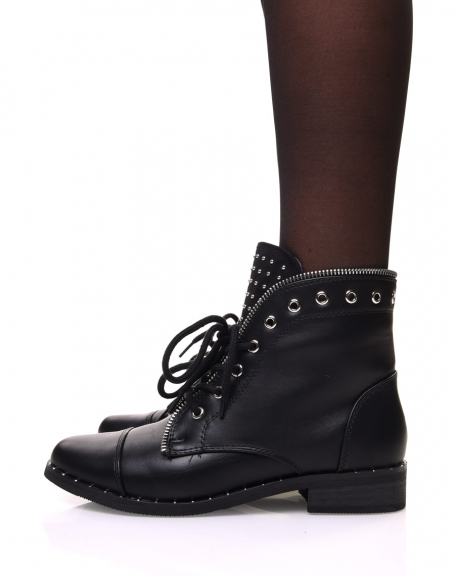 Black ankle boots with studded sole and eyelet edges