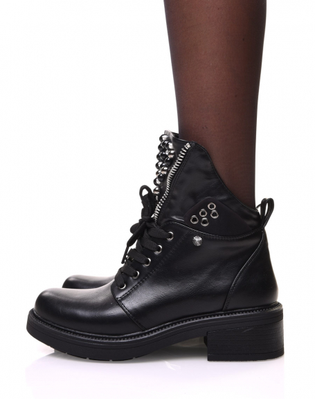 Black ankle boots with zipped and beaded tongue