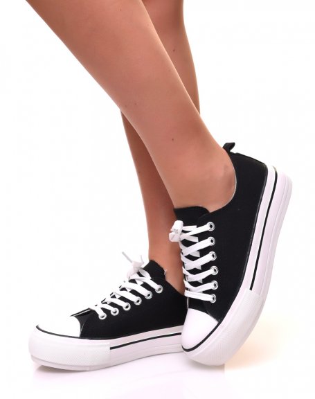 Black canvas sneakers with platforms decorated with trims