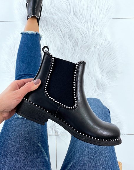 Black Chelsea boots adorned with silver pearls