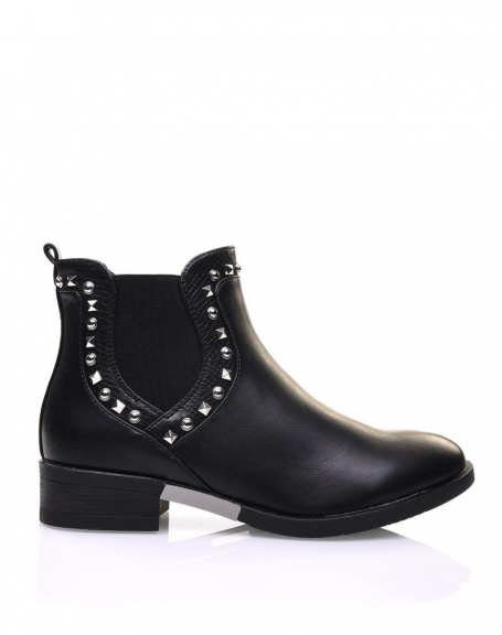 Black Chelsea boots adorned with studs