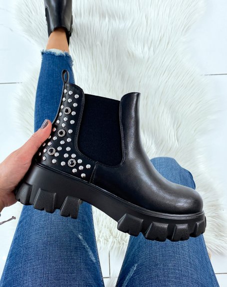Black Chelsea boots with embellishments and notched soles