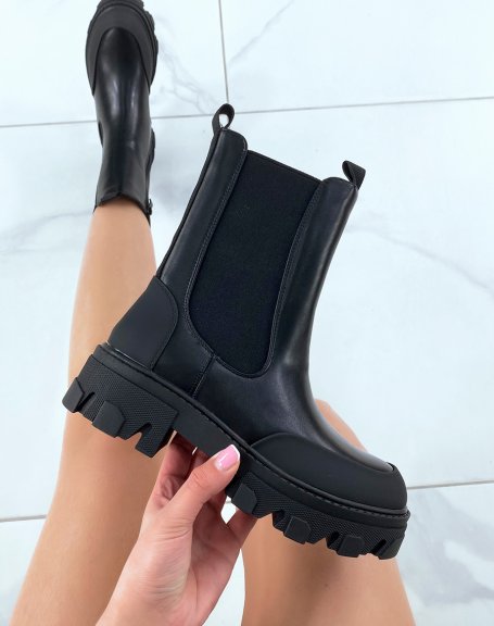 Black chelsea boots with notched sole