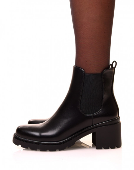 Black Chelsea boots with notched soles