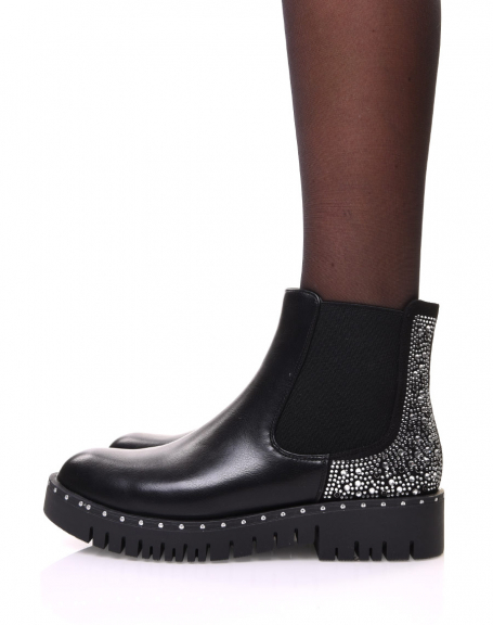 Black Chelsea boots with rhinestone details on the back