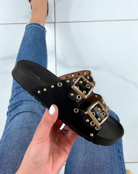 Black flat mules with adjustable straps and gold studs