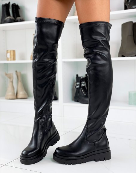 Black flat thigh-high boots with notched platform