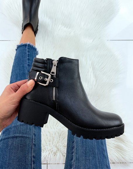 Black heeled ankle boots with decorative zip